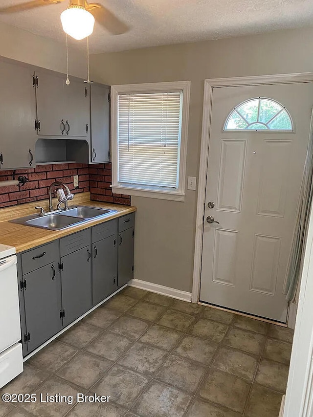 533 Lee Rd, Elizabethtown, KY 42701 - kitchen with a sink, gray cabinetry, white electric stove, ceiling fan, and light countertops
