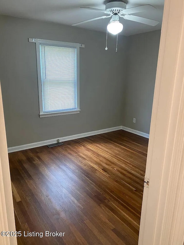 533 Lee Rd, Elizabethtown, KY 42701 - empty room featuring baseboards, dark wood-style floors, and a ceiling fan