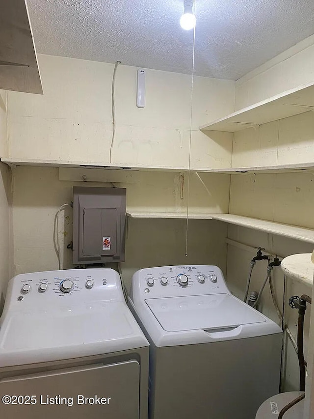 533 Lee Rd, Elizabethtown, KY 42701 - laundry room featuring washing machine and clothes dryer, a textured ceiling, and electric panel