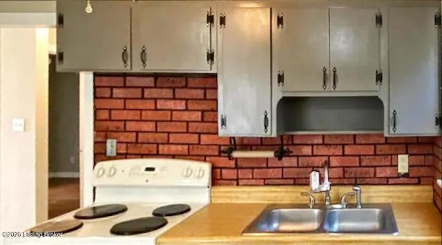 533 Lee Rd, Elizabethtown, KY 42701 - kitchen featuring electric range, a sink, decorative backsplash, and light countertops