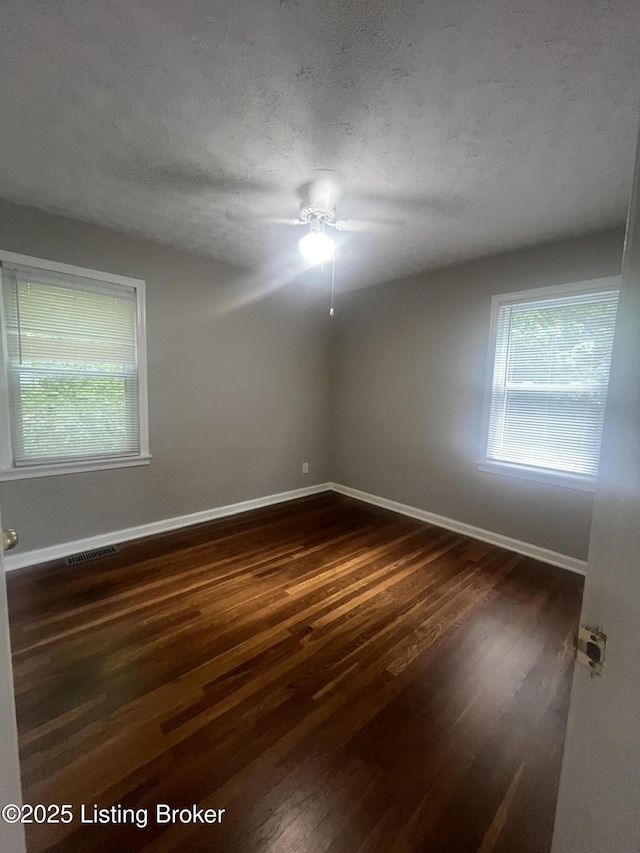 533 Lee Rd, Elizabethtown, KY 42701 - unfurnished room with dark wood-type flooring, ceiling fan, and a textured ceiling