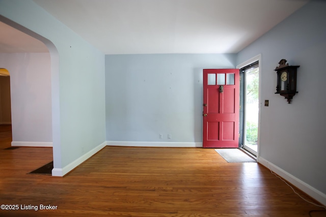 3521 Warner Ave, Louisville, KY 40207 - entryway featuring arched walkways, healthy amount of natural light, wood finished floors, and baseboards