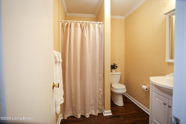 3521 Warner Ave, Louisville, KY 40207 - full bath with crown molding, wood finished floors, vanity, toilet, and baseboards