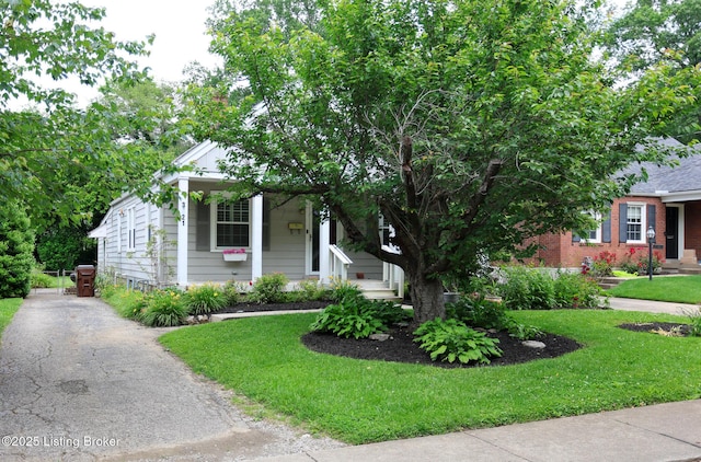 3521 Warner Ave, Louisville, KY 40207 - view of front facade with a front yard and asphalt driveway