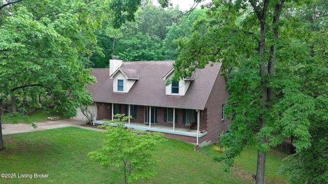 17 Bittersweet Pl, Brandenburg, KY 40108 - cape cod-style house with a porch, brick siding, a chimney, driveway, and a front yard