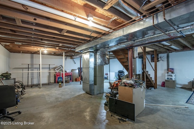 17 Bittersweet Pl, Brandenburg, KY 40108 - unfinished below grade area featuring heating unit, water heater, and stairs
