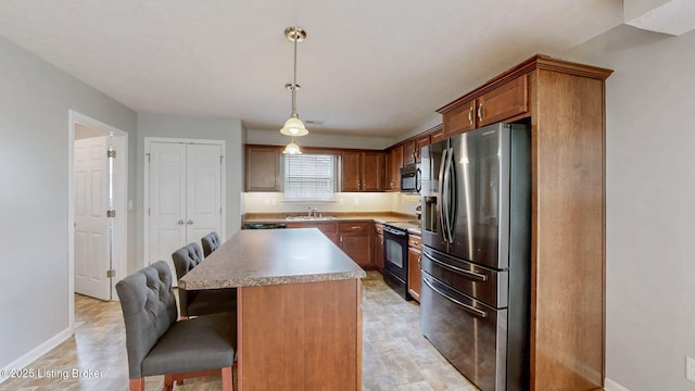 134 Wood Duck Ct, Shepherdsville, KY 40165 - kitchen with stainless steel fridge, a kitchen breakfast bar, black / electric stove, baseboards, and decorative light fixtures