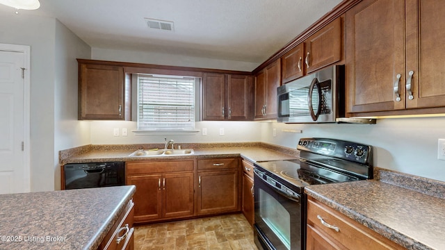 134 Wood Duck Ct, Shepherdsville, KY 40165 - kitchen featuring black appliances, a sink, dark countertops, and brown cabinetry