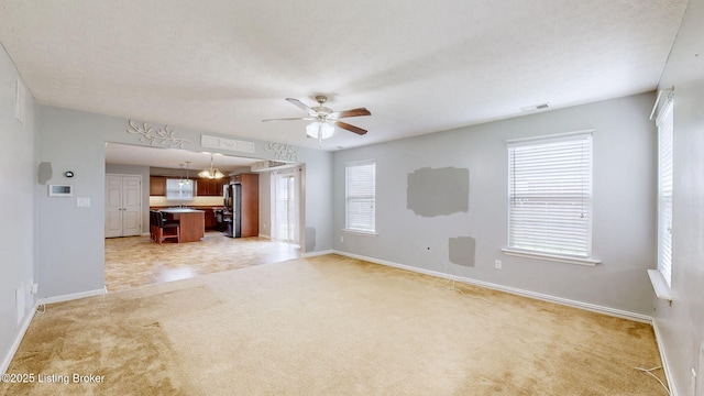 134 Wood Duck Ct, Shepherdsville, KY 40165 - unfurnished living room featuring light carpet, a ceiling fan, and baseboards