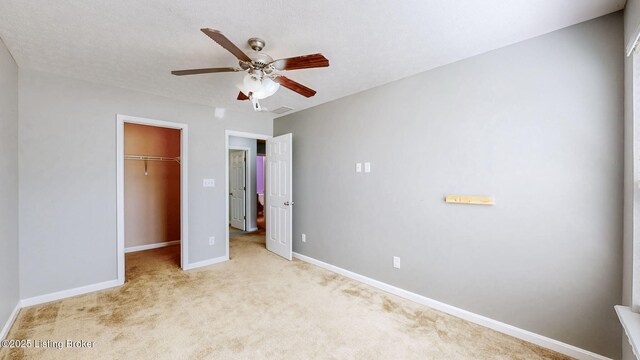 134 Wood Duck Ct, Shepherdsville, KY 40165 - unfurnished bedroom with baseboards, light carpet, a spacious closet, a closet, and a ceiling fan