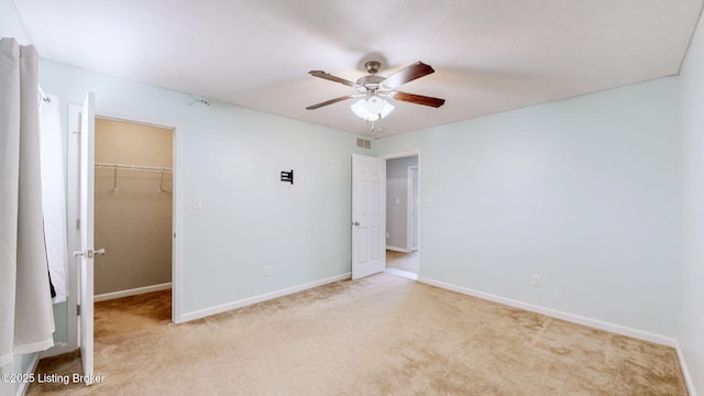 134 Wood Duck Ct, Shepherdsville, KY 40165 - unfurnished bedroom with light colored carpet, a walk in closet, a closet, and baseboards
