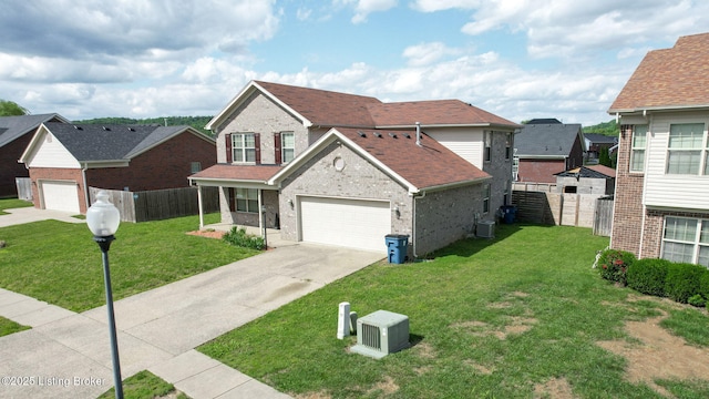 134 Wood Duck Ct, Shepherdsville, KY 40165 - traditional-style house with driveway, a garage, brick siding, and central air condition unit