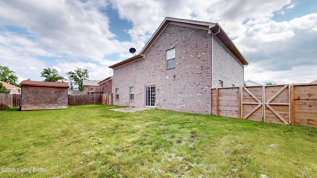 134 Wood Duck Ct, Shepherdsville, KY 40165 - rear view of house featuring brick siding, a gate, and a patio area