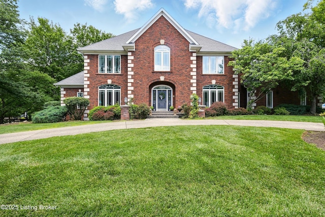 1014 Anchorage Woods Cir, Anchorage, KY 40223 - colonial-style house with a front yard, brick siding, and roof with shingles
