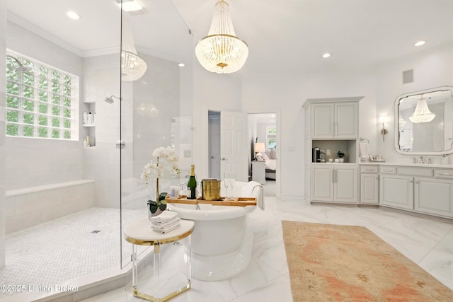 1014 Anchorage Woods Cir, Anchorage, KY 40223 - bathroom with a chandelier, walk in shower, a freestanding bath, vanity, and recessed lighting