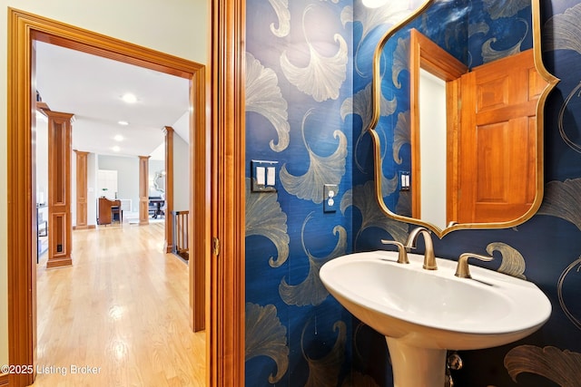 1014 Anchorage Woods Cir, Anchorage, KY 40223 - bathroom featuring decorative columns, wood finished floors, recessed lighting, and a sink