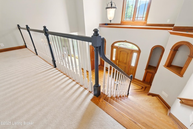 1014 Anchorage Woods Cir, Anchorage, KY 40223 - stairway with wood finished floors and baseboards