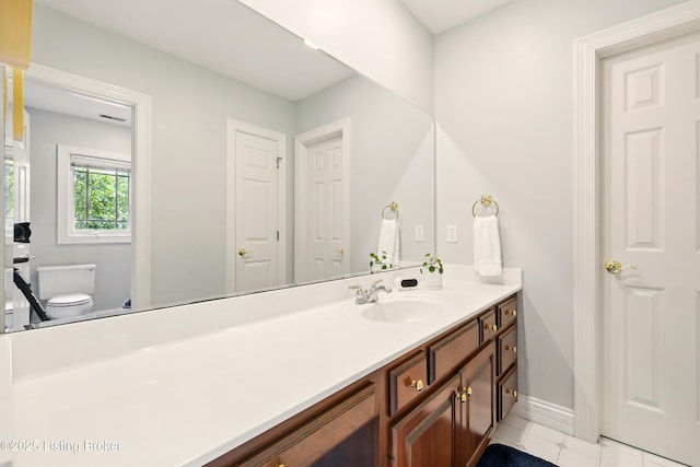 1014 Anchorage Woods Cir, Anchorage, KY 40223 - bathroom with toilet, vanity, tile patterned floors, and baseboards
