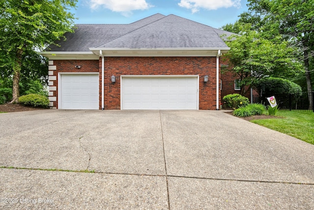 1014 Anchorage Woods Cir, Anchorage, KY 40223 - view of property exterior featuring roof with shingles, concrete driveway, a garage, and brick siding
