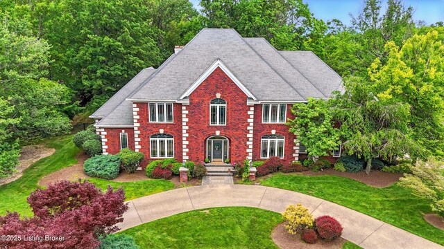 1014 Anchorage Woods Cir, Anchorage, KY 40223 - view of front of house featuring brick siding and a front yard