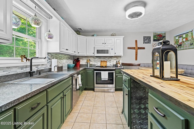 2327 Highgrove Rd, Coxs Creek, KY 40013 - kitchen with green cabinets, stainless steel appliances, butcher block counters, a sink, and white cabinetry
