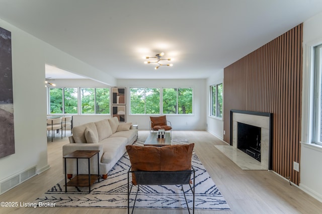 508 Wilderness Rd, Louisville, KY 40214 - living room featuring healthy amount of natural light, a premium fireplace, and light wood-type flooring