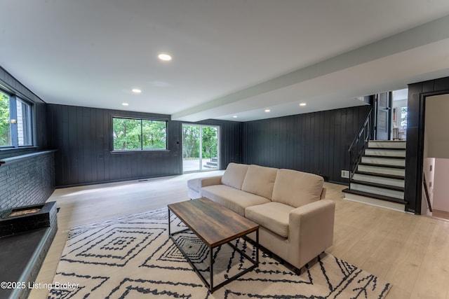 508 Wilderness Rd, Louisville, KY 40214 - living area featuring wood walls, light wood-type flooring, stairs, and recessed lighting
