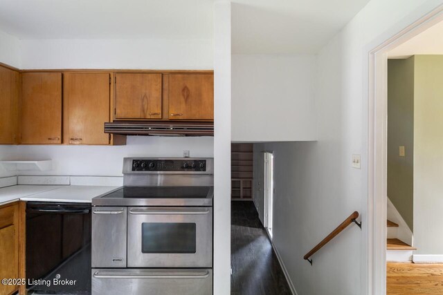2603 Ballad Blvd, Jeffersontown, KY 40299 - kitchen featuring range with two ovens, under cabinet range hood, wood finished floors, and brown cabinets