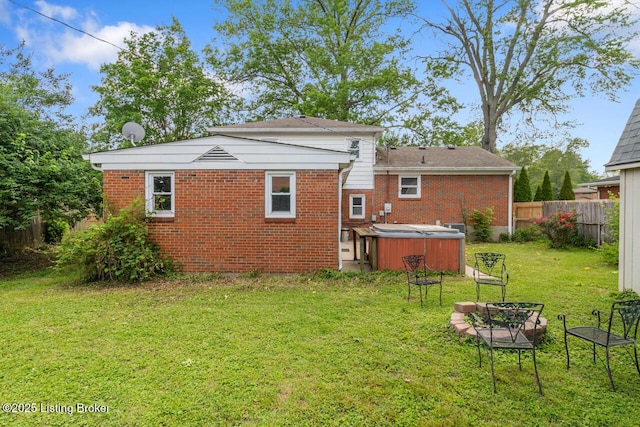 2603 Ballad Blvd, Jeffersontown, KY 40299 - back of property with a hot tub and brick siding