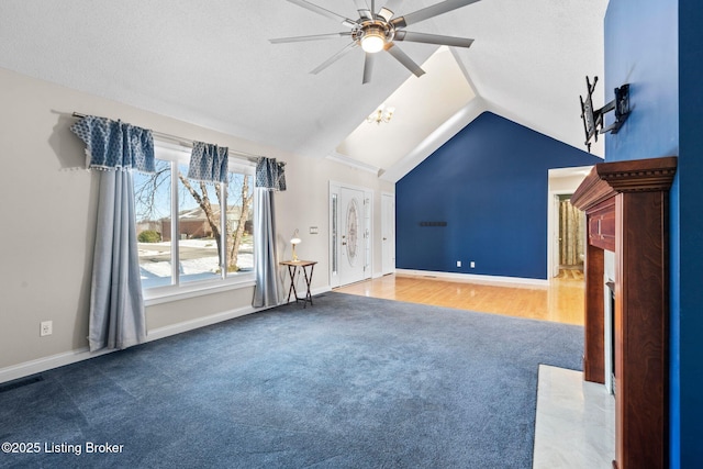 126 Deep Springs Dr, Bardstown, KY 40004 - unfurnished living room with carpet floors, ceiling fan, vaulted ceiling, baseboards, and a high end fireplace