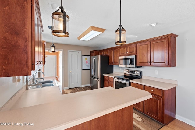 126 Deep Springs Dr, Bardstown, KY 40004 - kitchen featuring appliances with stainless steel finishes, a sink, light wood finished floors, and light countertops