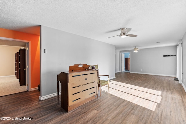 126 Deep Springs Dr, Bardstown, KY 40004 - spare room featuring wood finished floors, a ceiling fan, a textured ceiling, and baseboards