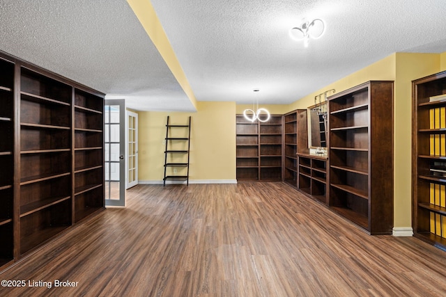 126 Deep Springs Dr, Bardstown, KY 40004 - unfurnished living room with wood finished floors, a textured ceiling, baseboards, and a chandelier