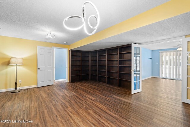 126 Deep Springs Dr, Bardstown, KY 40004 - unfurnished living room featuring wood finished floors, baseboards, and a textured ceiling
