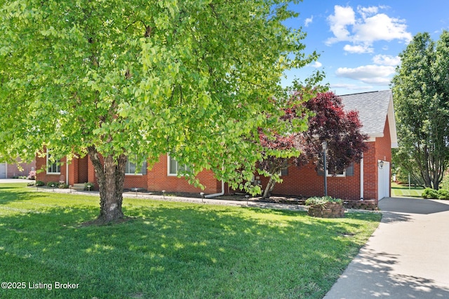 126 Deep Springs Dr, Bardstown, KY 40004 - obstructed view of property featuring brick siding, a garage, a front lawn, roof with shingles, and driveway