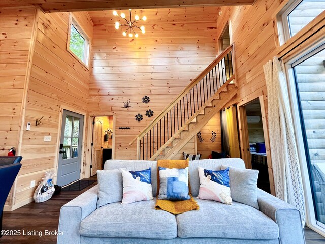 LOT3 Twin Arch Rd, Stanton, KY 40380 - living room with a towering ceiling, wooden walls, stairs, a chandelier, and wood finished floors