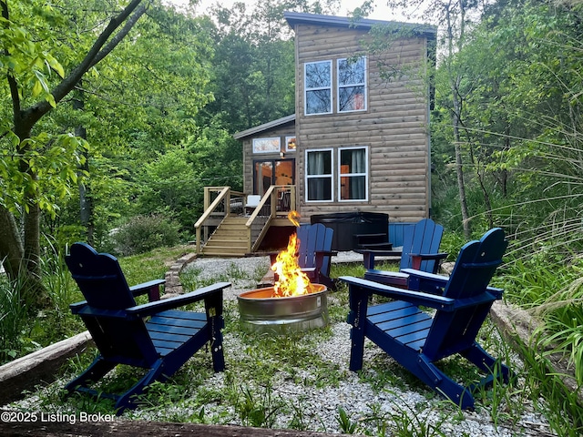 LOT3 Twin Arch Rd, Stanton, KY 40380 - rear view of property with a fire pit, a wooden deck, a view of trees, faux log siding, and a hot tub