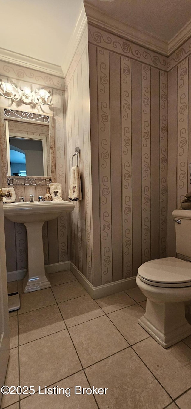6714 John Hancock Pl, Louisville, KY 40059 - bathroom with ornamental molding, toilet, and tile patterned flooring