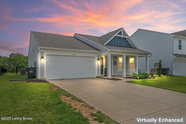 119 Wildflower Ave, Mt Washington, KY 40047 - view of front of house with driveway, a front lawn, a garage, and board and batten siding