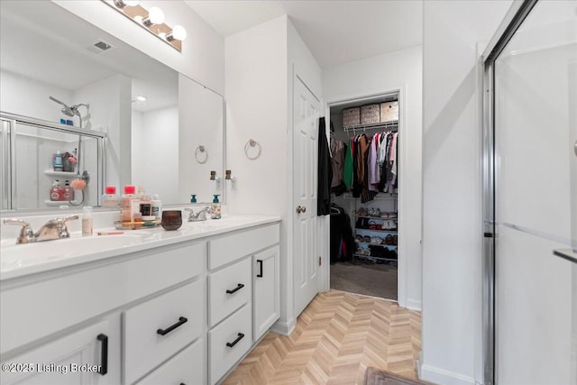 119 Wildflower Ave, Mt Washington, KY 40047 - bathroom with a stall shower, double vanity, and a spacious closet