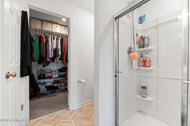 119 Wildflower Ave, Mt Washington, KY 40047 - bathroom with a stall shower, a spacious closet, and baseboards