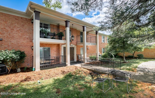 1508 Forest Park Rd, Louisville, KY 40223 - rear view of house with brick siding, an outdoor fire pit, a patio, and cooling unit