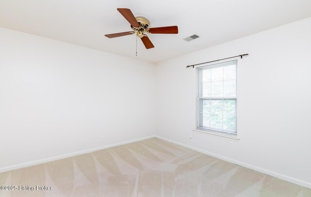 1508 Forest Park Rd, Louisville, KY 40223 - spare room with baseboards, light colored carpet, and a ceiling fan