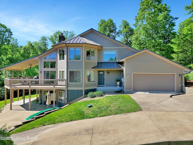763 Lochober Rd, Leitchfield, KY 42754 - view of front of property with a standing seam roof, a chimney, driveway, metal roof, and a wooden deck