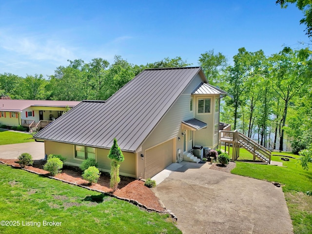 763 Lochober Rd, Leitchfield, KY 42754 - view of home's exterior featuring a standing seam roof, metal roof, and driveway