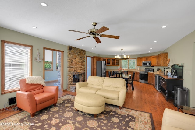 763 Lochober Rd, Leitchfield, KY 42754 - living room with light wood-style flooring, a chandelier, a fireplace, recessed lighting, and ceiling fan