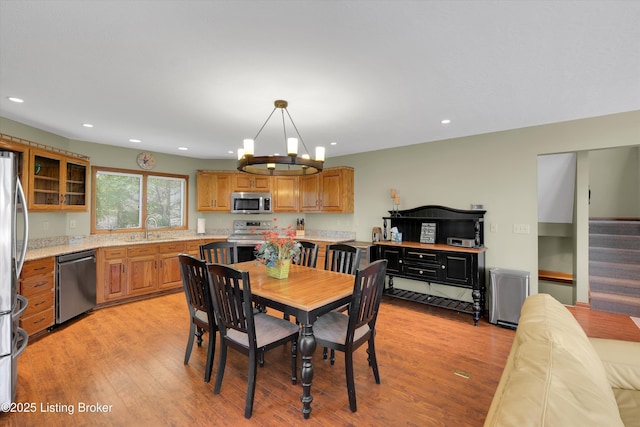 763 Lochober Rd, Leitchfield, KY 42754 - dining space with a chandelier, recessed lighting, light wood finished floors, and stairs