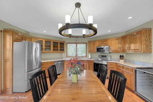 763 Lochober Rd, Leitchfield, KY 42754 - kitchen with appliances with stainless steel finishes, a chandelier, glass insert cabinets, recessed lighting, and pendant lighting