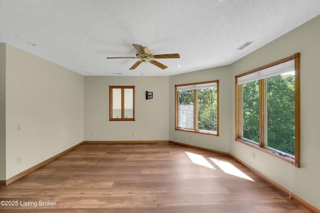 763 Lochober Rd, Leitchfield, KY 42754 - spare room with wood finished floors, a textured ceiling, ceiling fan, and baseboards