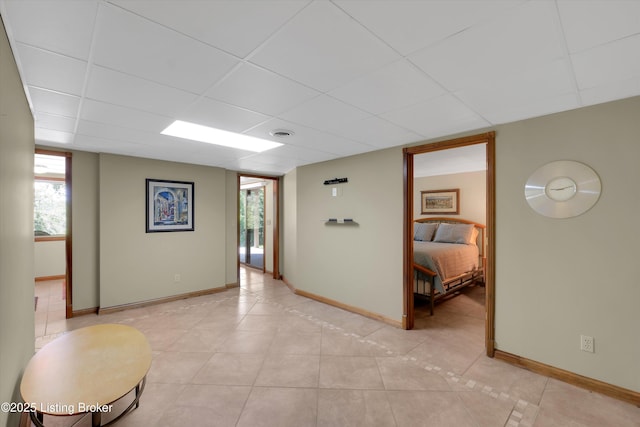 763 Lochober Rd, Leitchfield, KY 42754 - hall featuring a paneled ceiling, baseboards, and light tile patterned floors
